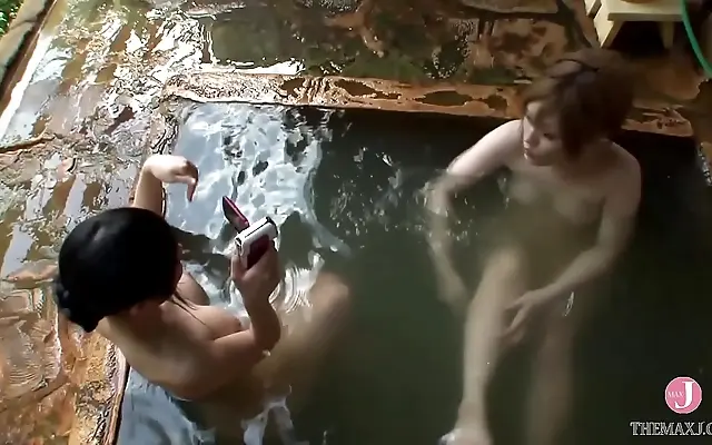 Japanese Beauty Seduces in a Hot Spring Fantasy with Luscious Curves