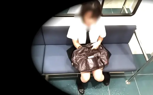 Her desire flares up as she secretly pleasures herself under her bag on the train